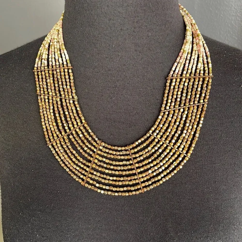 Multi strand bronze and pastel bead necklace.